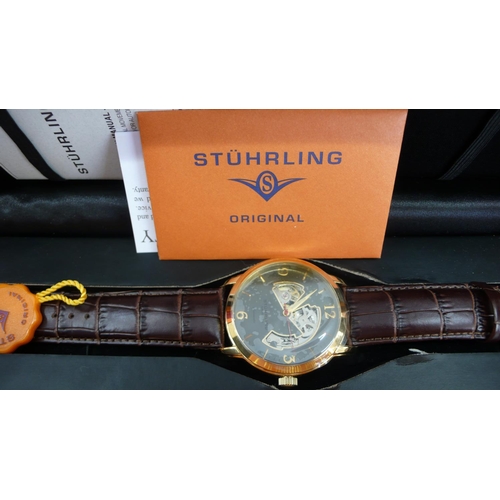 29 - A Stuhrling Gent's automatic wrist watch (boxed with papers) etc