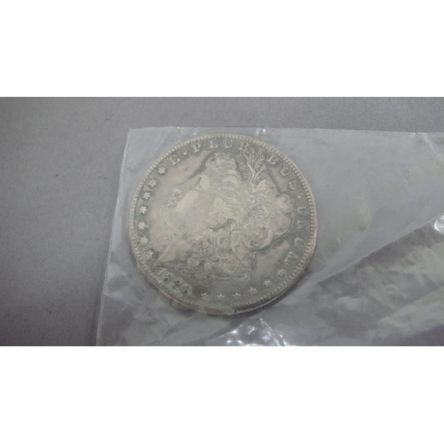 129 - An 1888 US silver dollar