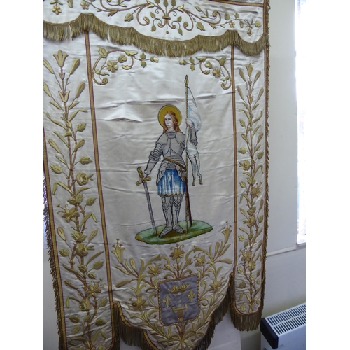 307 - A 19thC French silk and gold thread church banner with flora and fauna to borders, St. Joan of Arc t... 