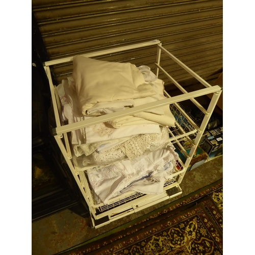 110 - Metal  baskets with numerous items of linen