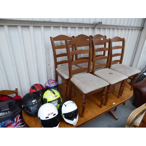 29 - Large mahogany heavy oval dining table with eight chairs including two carvers