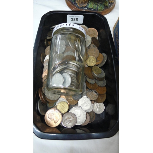 385 - Tub and a jar of UK and worldwide coinage