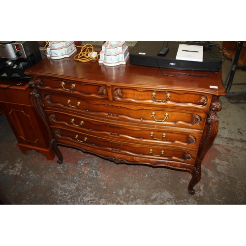 12 - Serpentine fronted chest of four drawers with brass swing handles