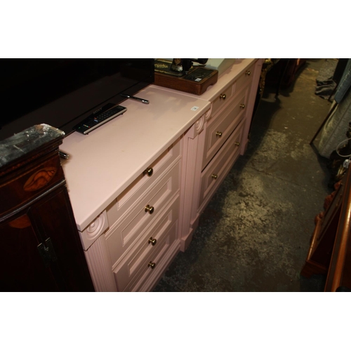 49 - Two pink painted, heavy chest of drawers