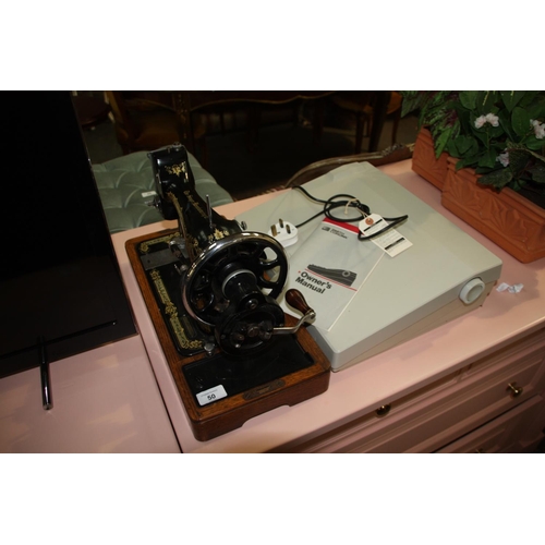 50 - Singer sewing machine plus an electric Smith Corona typewriter