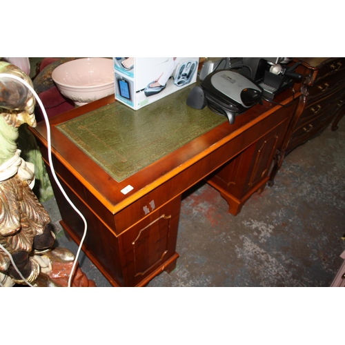 9 - Desk with green leather insert, nine drawers and swing handles