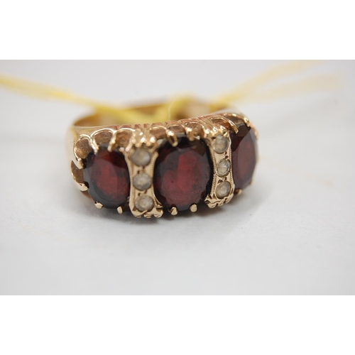 189 - 9 ct. gold garnet and white stone ring - size J/K