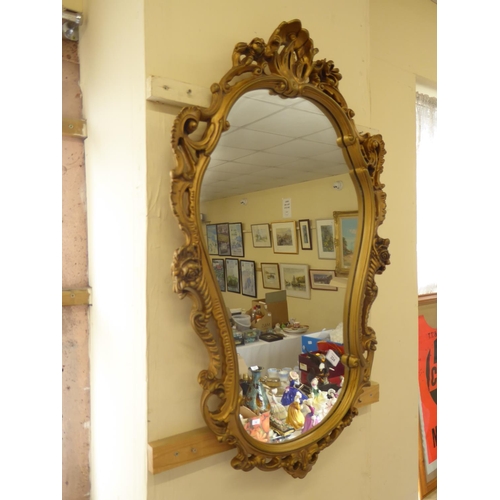 289 - An ornate gilt framed mirror