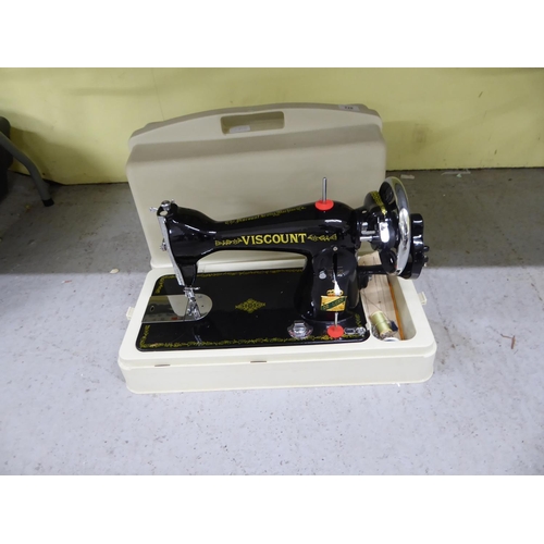 228 - A cased Viscount hand operated sewing machine