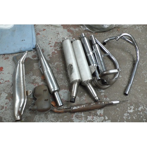 103 - Collection of motorcycle exhausts and silencers including Fishtail and Ducati