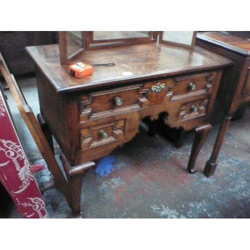 12 - Oak low boy desk, three drawers on carved legs