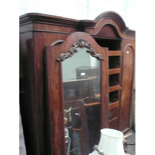 8 - Victorian mahogany triple wardrobe with drawers and slides to centre unit