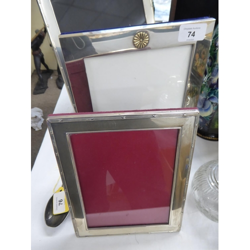 74 - Two silver photo frames largest 11