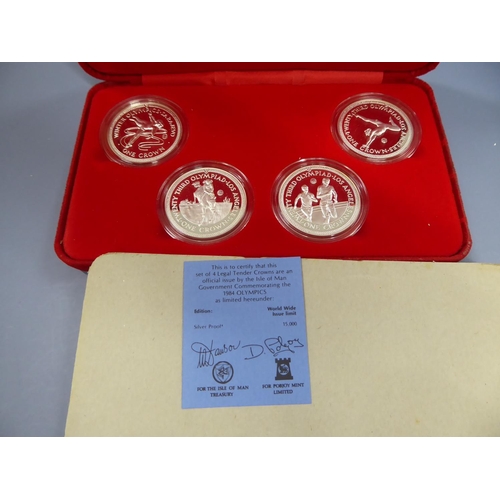 103 - Cased set of IOM silver proof 1984 Olympics crowns with certificate