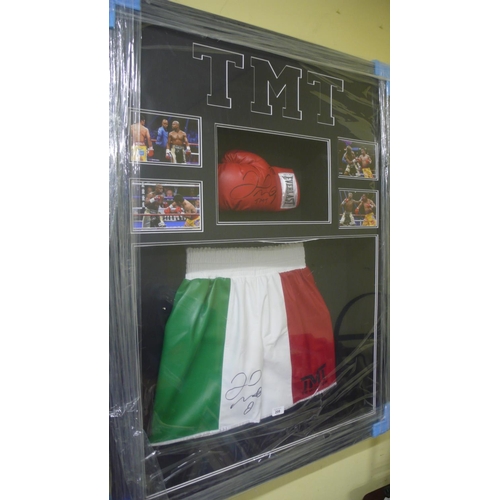 336 - A large well framed and illuminated with LED strips Floyd Mayweather signed boxing glove and shorts