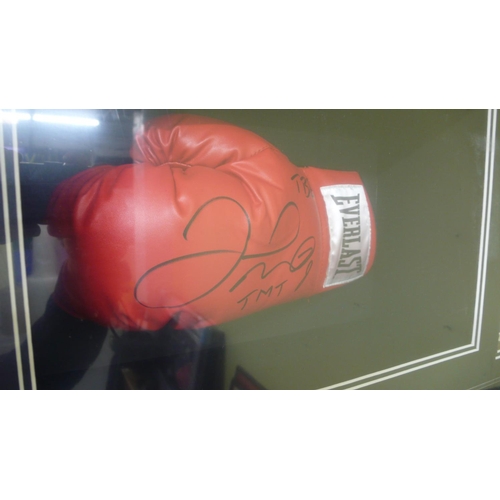 336 - A large well framed and illuminated with LED strips Floyd Mayweather signed boxing glove and shorts