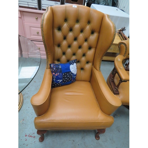 16 - Studded and button back leather wing chair