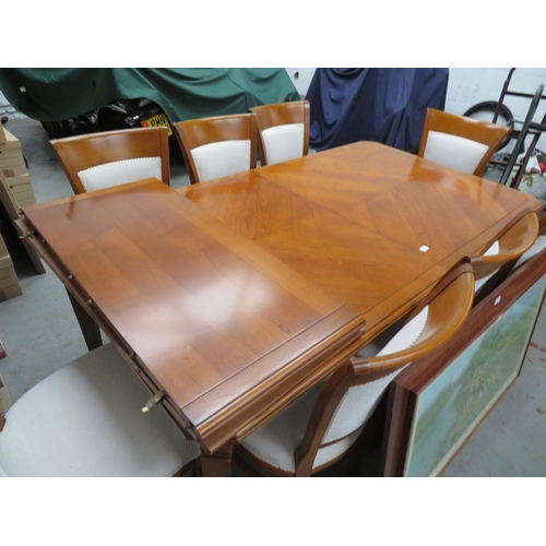 24 - Extending dining table with quartered top and eight matching chairs, includes two inserts. Length 80... 