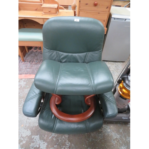 36 - Green leather stressless style chair and matching footstool