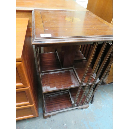 50 - Revolving book case with inlaid top