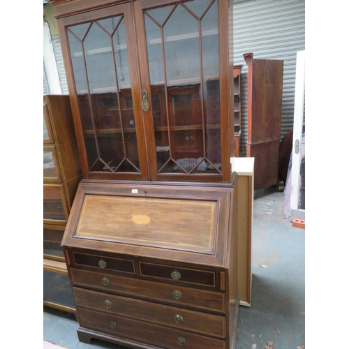 52 - Bureau bookcase with three long and two short drawers and glazed doors to top