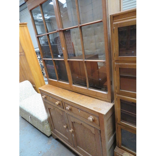 54 - Oak bookcase with cupboards and two drawers to base