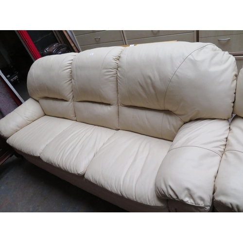 76 - Cream leather three seater settee