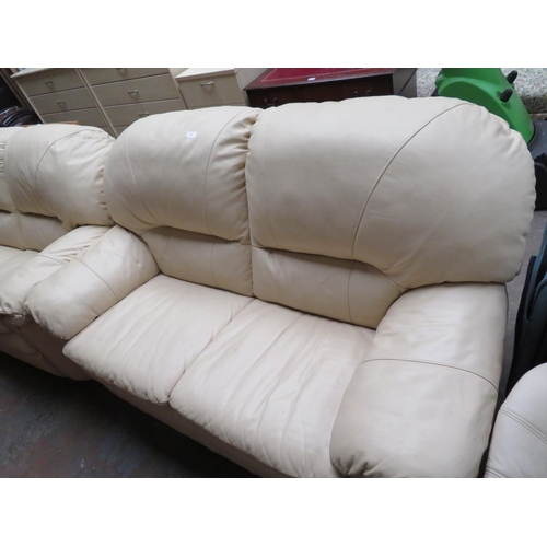 77 - Two seater cream leather settee