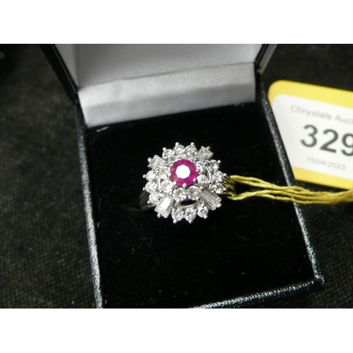 329 - A pretty ruby and mixed cut diamond ring set is 18 ct. reeded shank.  Approx. 2 carats of diamonds -... 