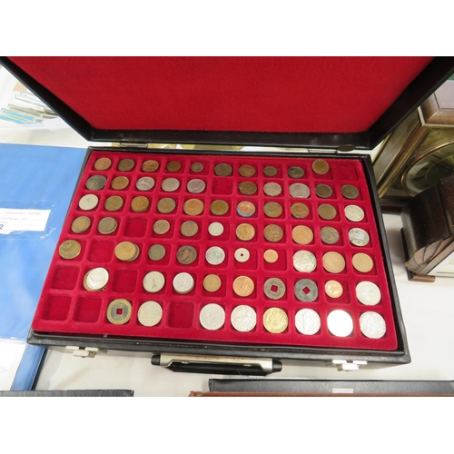 251 - A suitcase containing hundreds of worldwide coins