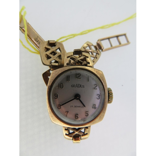 198 - A 9 ct. gold ladies wrist watch with gold strap, 14.7 grammes total