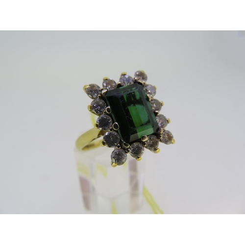 273 - An 18 ct. gold green tourmaline and diamond ring - size M