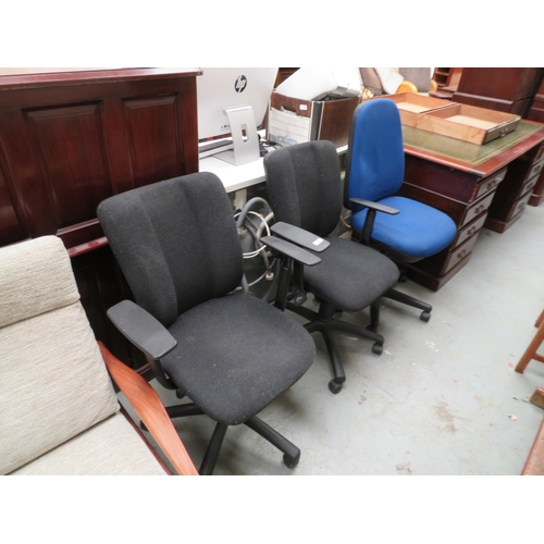 135 - Three swivel office chairs