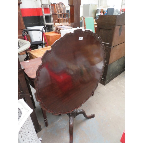 77 - George III Mahogany flip top tripod table with pie crust edge