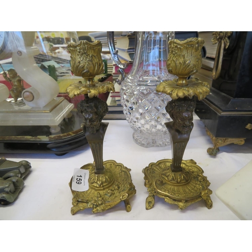 159 - Pair of quality ormolu and bronze candlesticks with mask decoration to stem Height 8