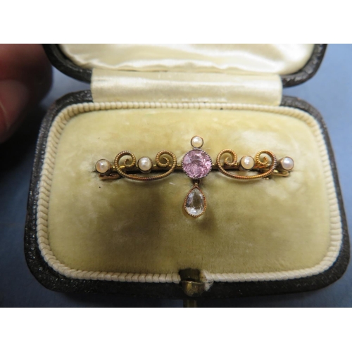 90 - An Edwardian pink tourmaline bar brooch with a drop pendant