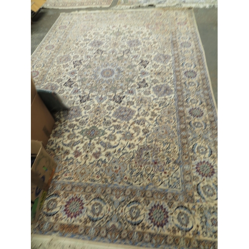 50 - Silk and wool carpet in mostly blue, cream, green and rust wools. Approx 244cm x 320cm