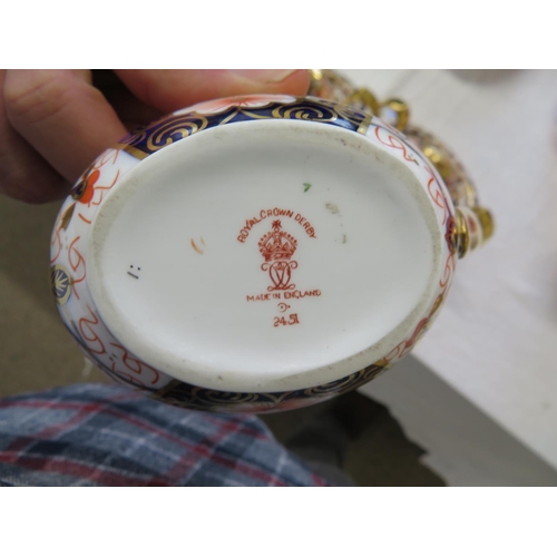 45 - A pair of Royal Crown Derby Imari pattern oval two handled urns with a matching cream jug