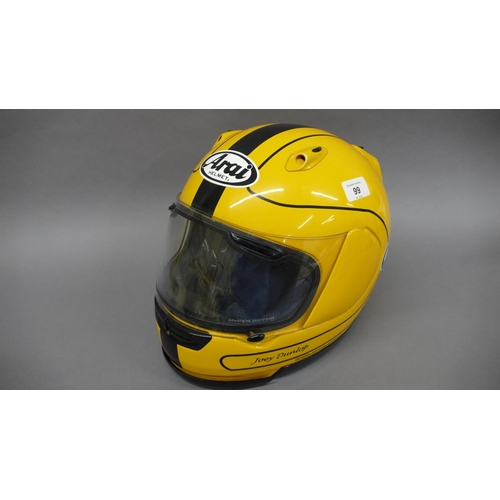 244 - A Joey Dunlop ARAI helmet with dust bag