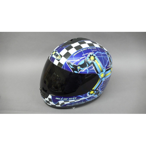 245 - An unused motorcycle helmet signed by John McGuiness