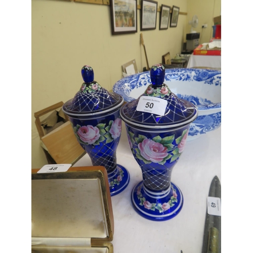 50 - Pair of painted Bristol blue glass urns with rose decoration - ht. 9 ins