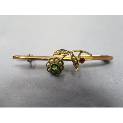 65 - A gold peridot, seed pearl and ruby brooch