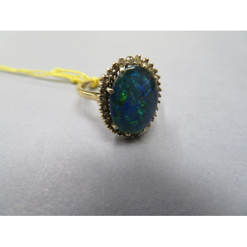 69 - Gold and opal ring - size O