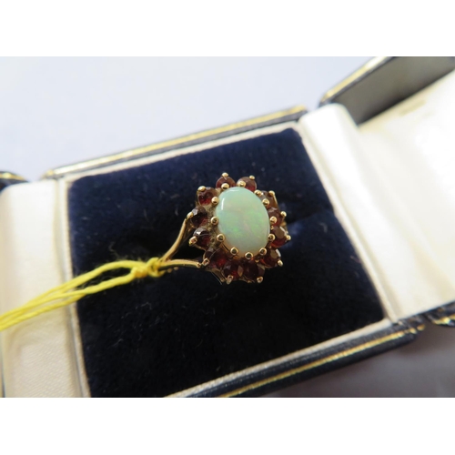 70 - Gold, opal and garnet ring - size S