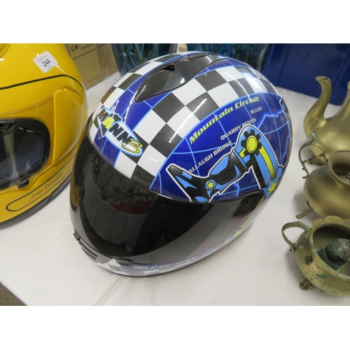 245 - An unused motorcycle helmet signed by John McGuiness