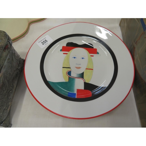 255 - A porcelain plate signed K Malevich having the image of  'Girl with a Comb in her Hair'.