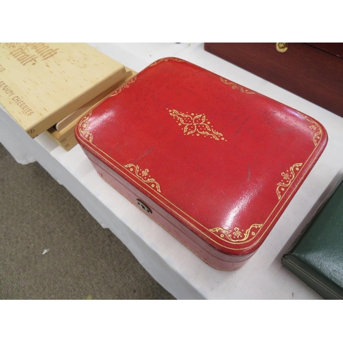 259 - A good quality red tooled leather jewellery box plus some items of ethnic jewellery within