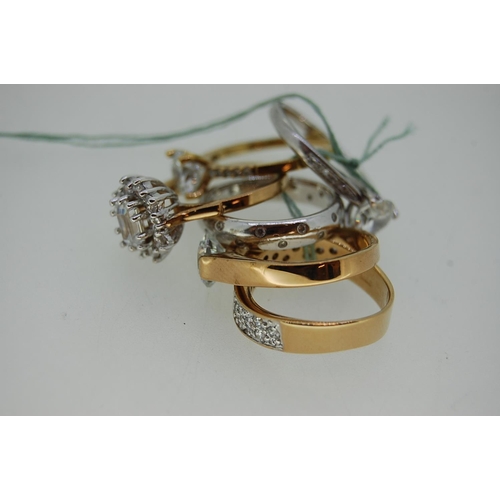 349 - Six silver or gold plated white stone rings