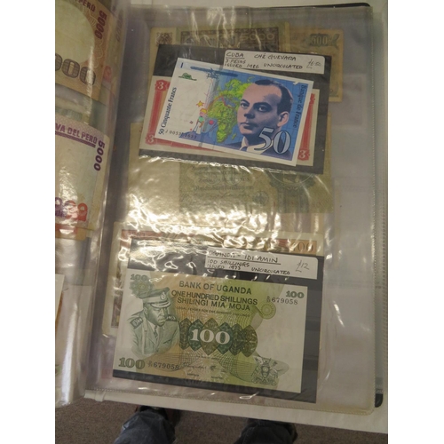 32 - A folder full of numerous world wide bank notes