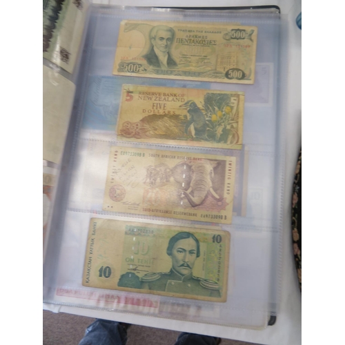 32 - A folder full of numerous world wide bank notes